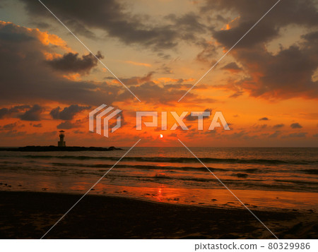 Sunset on a tropical beach with a lighthouse (Kaorak, Phang Nga Province, Kingdom of Thailand) 80329986