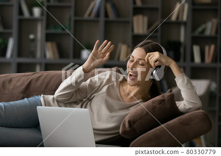 Happy young woman holding online video call conversation. Happy young woman holding online video call conversation. 80330779