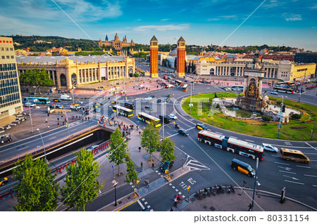 Placa d'Espanya, Barcelona, Spain with city traffic on sunset Placa d'Espanya, Barcelona, Spain with city traffic on sunset 80331154