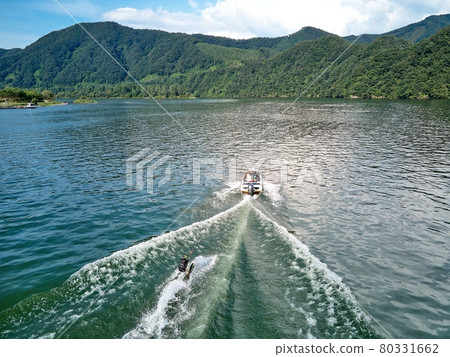 People enjoying water skiing and boating on the cool Bukhangang River. 80331662