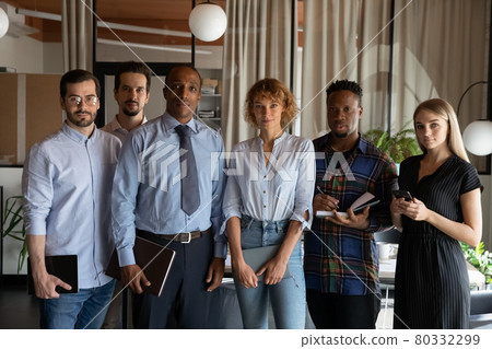 Portrait of diverse employees team colleagues standing in office Portrait of diverse employees team colleagues standing in office 80332299