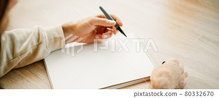 Banner with man hands writing in a blank notebook 80332670