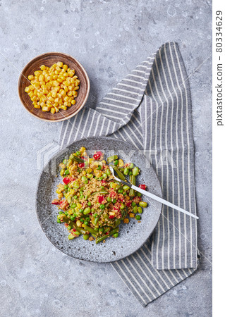 Quinoa salad with green beans, corn, red bell peppers, peas and soybeans. Useful vegetable mix Quinoa salad with green beans, corn, red bell peppers, peas and soybeans. Useful vegetable mix 80334629