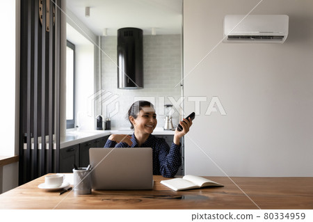 Happy female Indian student or employee working from home 80334959