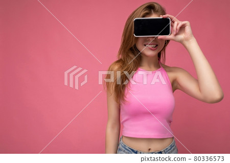Photo of beautiful smiling young woman good looking wearing casual stylish outfit standing isolated 80336573