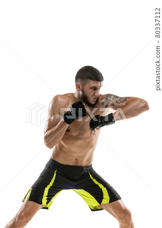 Portrait of professional male MMA boxer practicing isolated on white studio background. Fit muscular caucasian athlete fighting. Portrait of professional male MMA boxer practicing isolated on white studio background. Fit muscular caucasian athlete fighting. 80337112