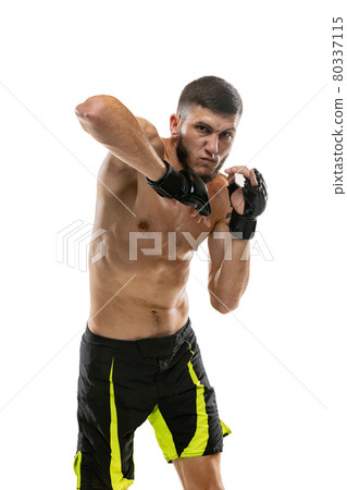 Close-up professional male MMA boxer in motion isolated on white studio background. Fit muscular caucasian athlete fighting. Close-up professional male MMA boxer in motion isolated on white studio background. Fit muscular caucasian athlete fighting. 80337115