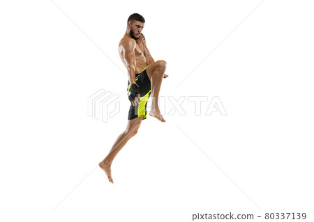 Professional male MMA boxer in motion isolated on white studio background. Fit muscular caucasian athlete fighting. Professional male MMA boxer in motion isolated on white studio background. Fit muscular caucasian athlete fighting. 80337139