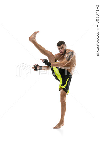 Professional male MMA boxer in motion isolated on white studio background. Fit muscular caucasian athlete fighting. Professional male MMA boxer in motion isolated on white studio background. Fit muscular caucasian athlete fighting. 80337143