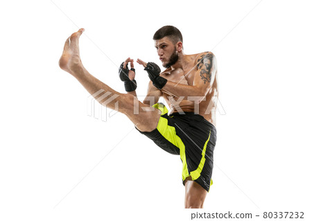 Professional male MMA boxer in motion isolated on white studio background. Fit muscular caucasian athlete fighting. Professional male MMA boxer in motion isolated on white studio background. Fit muscular caucasian athlete fighting. 80337232