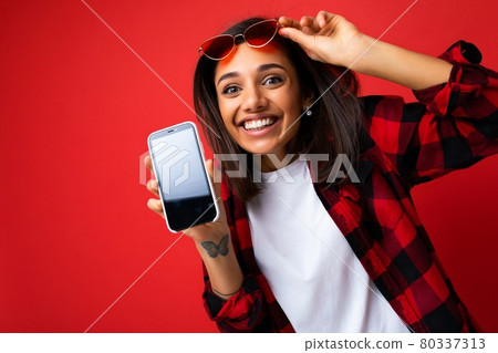Photo of beautiful smiling young woman good looking wearing casual stylish outfit standing isolated Photo of beautiful smiling young woman good looking wearing casual stylish outfit standing isolated 80337313