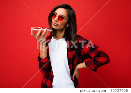 photo of beautiful upset young brunet woman wearing stylish red shirt white t-shirt and red 80337406