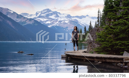 Adventurous White Caucasin Adult Woman Hiking on a trail in Canadian Nature 80337796
