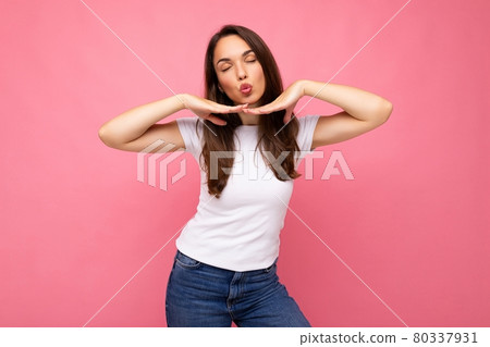 Portrait photo of young happy positive beautiful brunette woman with sincere emotions wearing casual 80337931
