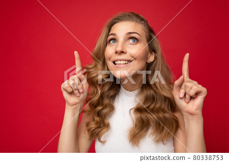 Photo of young positive happy smiling beautiful woman with sincere emotions wearing stylish clothes 80338753