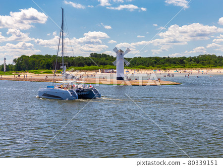 Swinoujscie. The famous old windmill lighthouse on a sunny day. 80339151