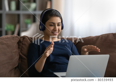 Smiling Indian woman talk on webcam call on computer 80339493