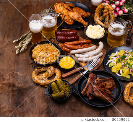 Oktoberfest dishes with beer, pretzel and sausage Oktoberfest dishes with beer, pretzel and sausage 80339961