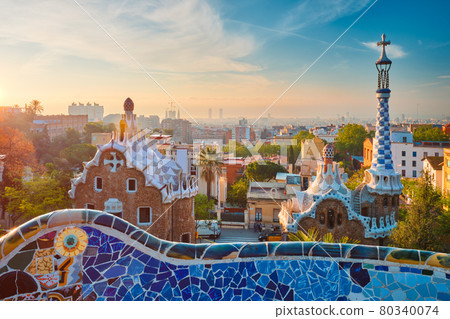 Barcelona city view from Guell Park. Sunrise view of colorful mosaic building in Park Guell 80340074