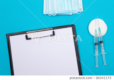 Vaccination or Revaccination Concept - Two Medical Syringe on Blue Table 80341173