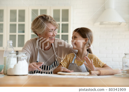 Joyful different generations family involved in culinary activity. 80341909