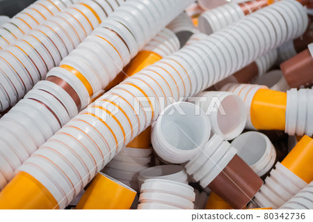 Many stacks of empty orange and brown plastic cups at warehouse - close up Many stacks of empty orange and brown plastic cups at warehouse - close up 80342736