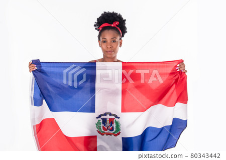 Latina woman calmly holding the Dominican Republic flag: Flags and diversity concept. 80343442