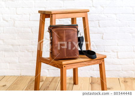Beautiful brown bag made of leather designed for various items 80344448