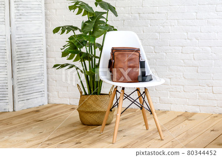 Beautiful brown bag made of leather designed for various items 80344452