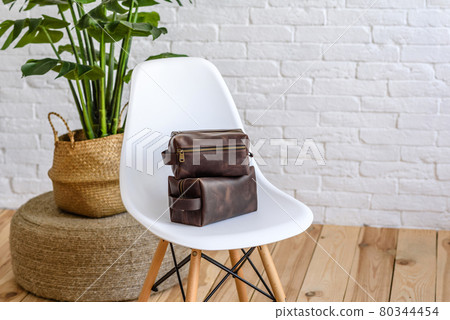 Beautiful brown bag made of leather designed for various items 80344454