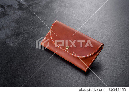 Beautiful leather brown purse made of leather to store paper money Beautiful leather brown purse made of leather to store paper money 80344463