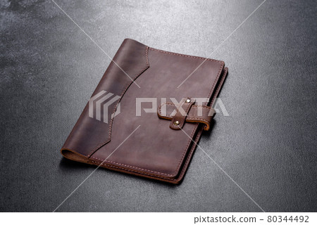 Beautiful leather brown case made of leather designed for a notebook Beautiful leather brown case made of leather designed for a notebook 80344492