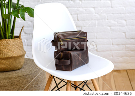 Beautiful brown bag made of leather designed for various items 80344626