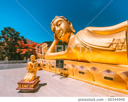 Wat Khao Sung Chaem Fa temple with giant snake and reclining gold buddha, in Kanchanaburi, Thailand Wat Khao Sung Chaem Fa temple with giant snake and reclining gold buddha, in Kanchanaburi, Thailand 80344940