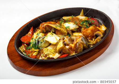 Stewed vegetables with meat in gravy and decorated fresh herbs Stewed vegetables with meat in gravy and decorated fresh herbs 80345037