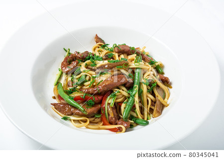 Thai noodles with ostrich meat, green beans and mushrooms. Thai noodles with ostrich meat, green beans and mushrooms. 80345041