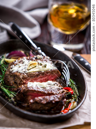 Healthy lean grilled medium-rare steak and vegetables 80345046