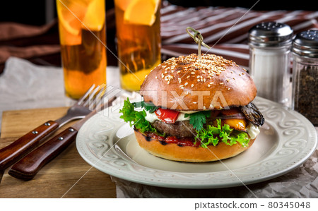 Sandwich with chicken burger, tomatoes, cheese and lettuce Sandwich with chicken burger, tomatoes, cheese and lettuce 80345048