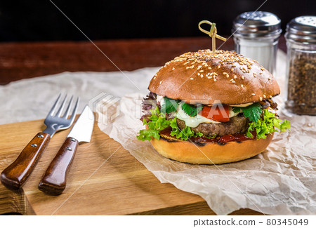 Homemade burger on the wooden table Homemade burger on the wooden table 80345049
