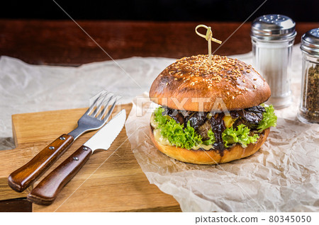 Burger on the table with devices Burger on the table with devices 80345050