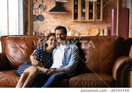 Happy young married man and woman enjoying leisure time Happy young married man and woman enjoying leisure time 80345549