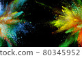 Multi-color powder explosion on black background 80345952