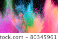 Multi-color powder explosion on black background 80345961