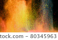 Multi-color powder explosion on black background 80345963