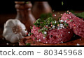 Super slowmotion footage of strewing salt and herbs at fresh raw beef meat burger, 1000fps, 4K 80345968