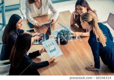 Businesswomen in Meeting, Laptop Computer on Table 80346314