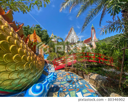 Wat Khao Sung Chaem Fa temple with giant snake and reclining gold buddha, in Kanchanaburi, Thailand Wat Khao Sung Chaem Fa temple with giant snake and reclining gold buddha, in Kanchanaburi, Thailand 80346902