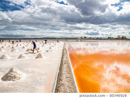 Phetchaburi Salt flats Naklua, farms and farmers collecting salt in Phetchaburi, Thailand Phetchaburi Salt flats Naklua, farms and farmers collecting salt in Phetchaburi, Thailand 80346926