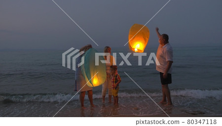 Happy Family Releasing Sky Lantern Happy Family Releasing Sky Lantern 80347118