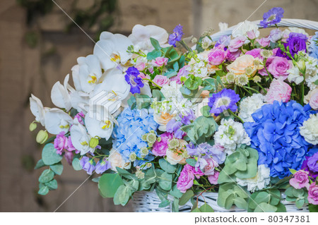 Large floral basket with flowers at flower shop Large floral basket with flowers at flower shop 80347381